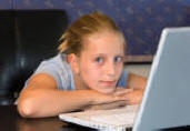 young girl using computer