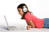 young child listening to downloaded music